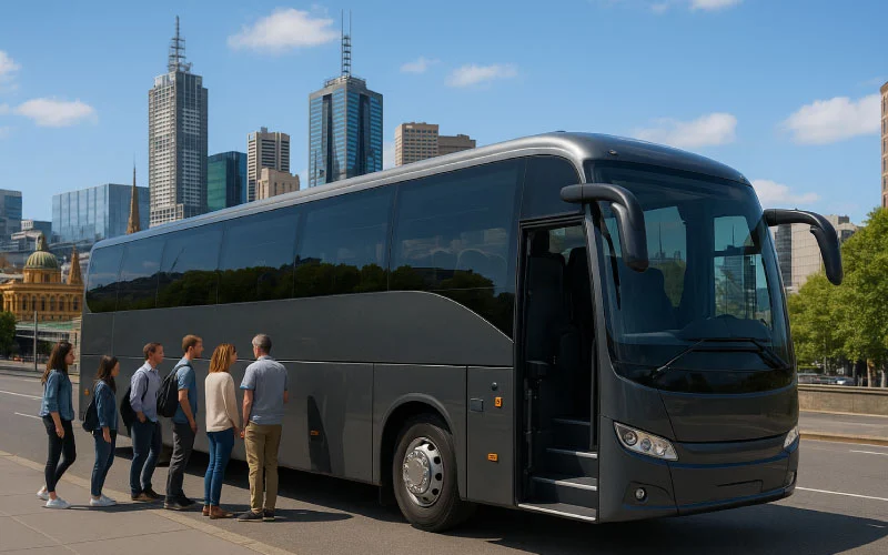 A modern coach parked in central Melbourne, ready for group boarding.