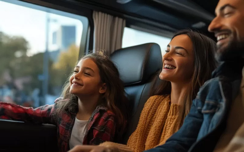 Family enjoying a comfortable Melbourne coach hire ride on a day trip